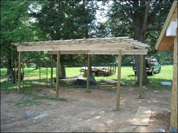 installation of rough hewn pergola shade structure