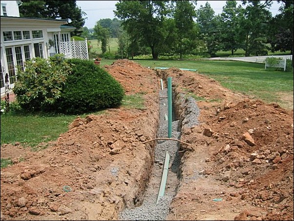 Pipes are laid within the trenches