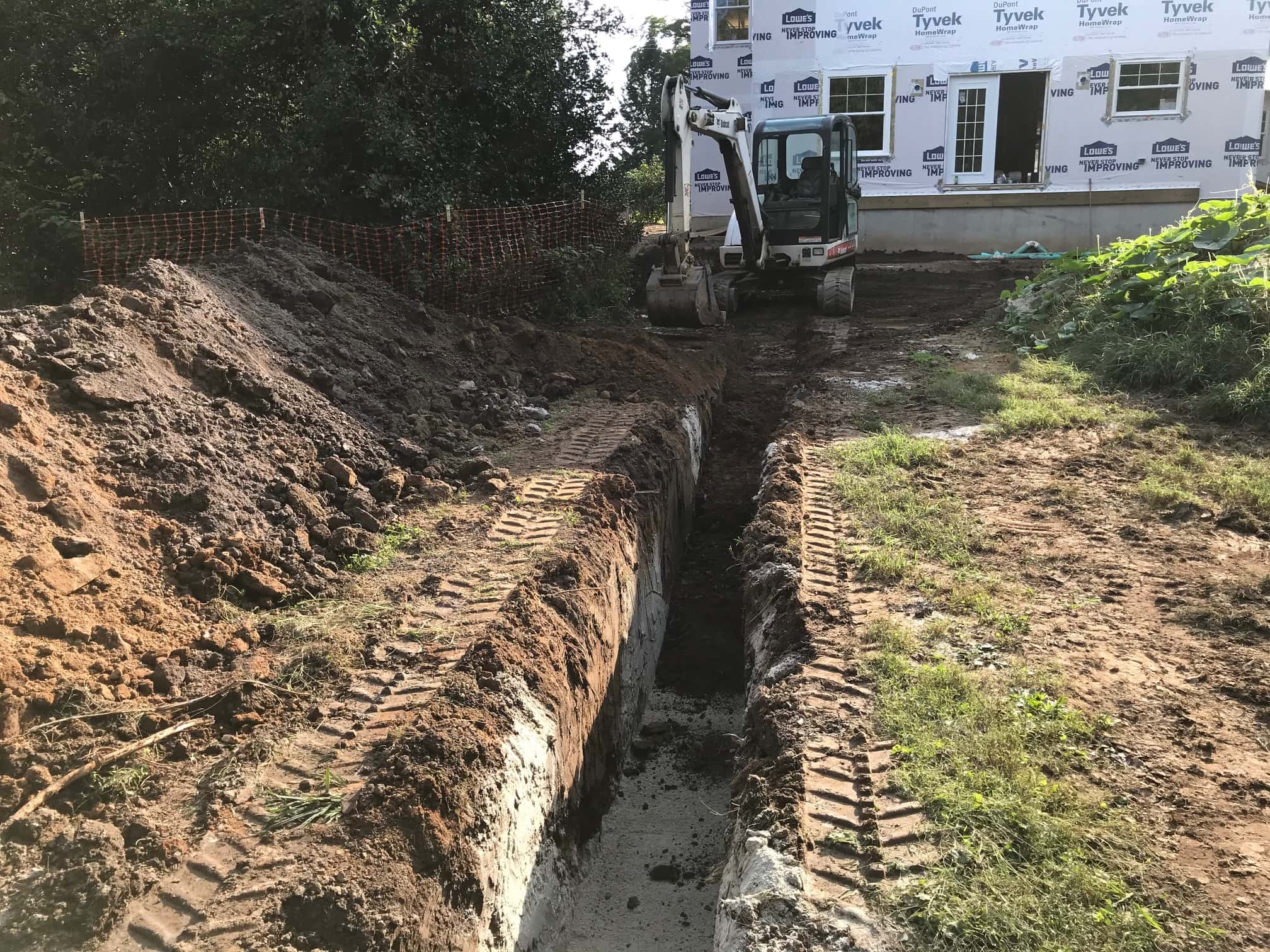 GBR dig trenches from the downspout locations to the storm water facility
